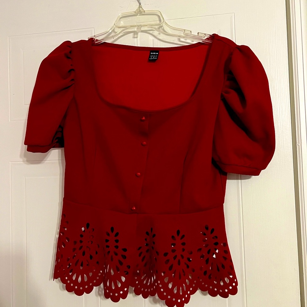 A cute, flattering, wine red, puffy sleeved blouse